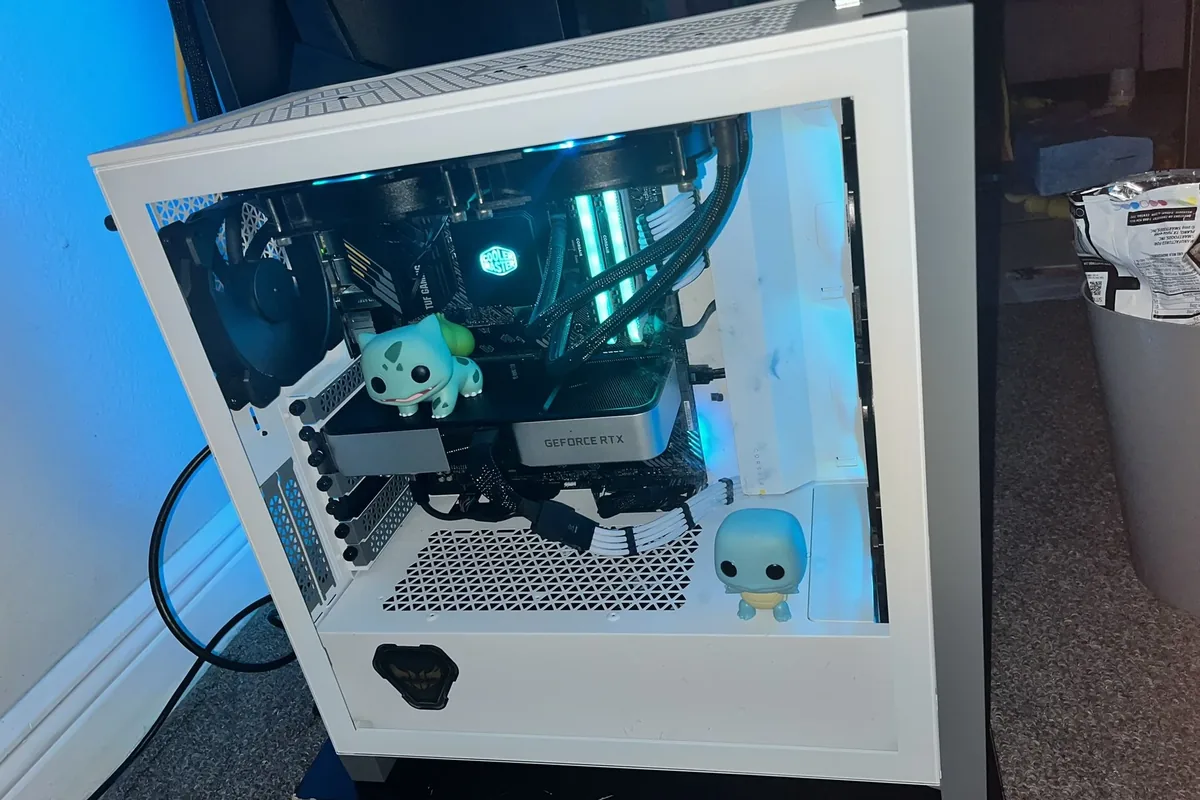 Custom-built gaming PC with liquid cooling, RTX GPU, and RGB lighting