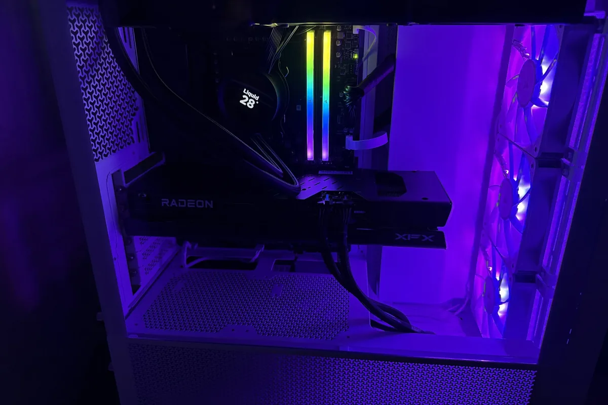 Inside a computer case with RGB lighting, Radeon graphics card, and cooling fans