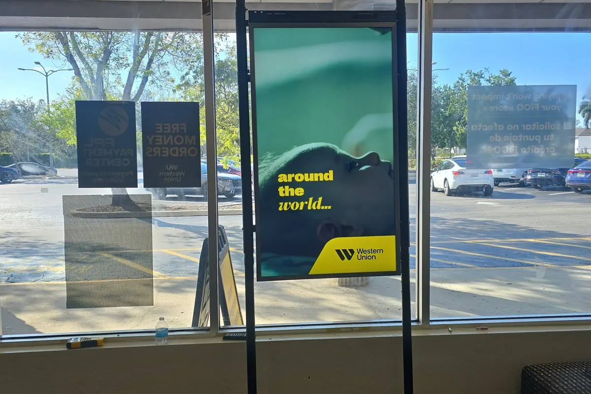 Digital signage screen installed for a Western Union store in Naples